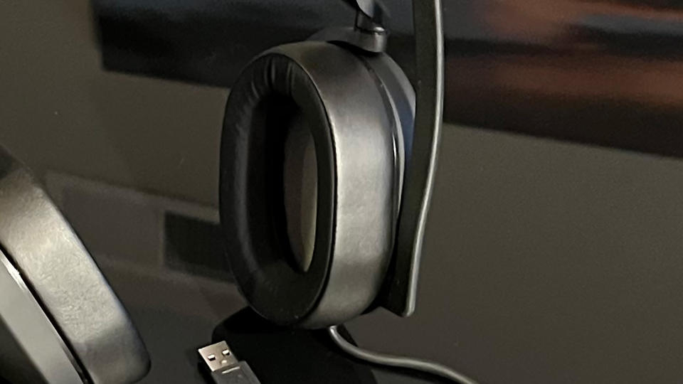 A Corsair HS65 Surround on a reflective black table