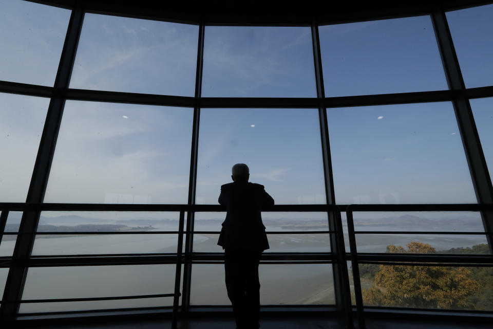 A man watches the North side from the unification observatory in Paju, South Korea, Thursday, Oct. 25, 2018. Since the Korean War's end, the Koreas remain split along the 248-kilometer (155-mile) -long border, called the DMZ. An estimated 2 million mines are peppered inside and near the DMZ, which is also guarded by barbed wire fences, tank traps and combat troops on both sides. (AP Photo/Lee Jin-man)