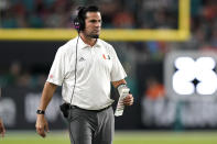 Miami head coach Manny Diaz watches during the first half of an NCAA college football game against Virginia Tech, Saturday, Nov. 20, 2021, in Miami Gardens, Fla. (AP Photo/Lynne Sladky)