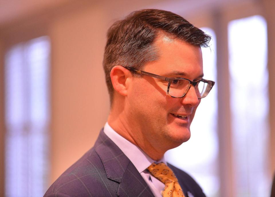 Derham Cole, Jr. has been named the interim chancellor at USC-Upstate. Cole chats with staff and board members during a reception at the college in Spartanburg, Wednesday morning, Feb. 19, 2020. [TIM KIMZEY/Spartanburg Herald-Journal]