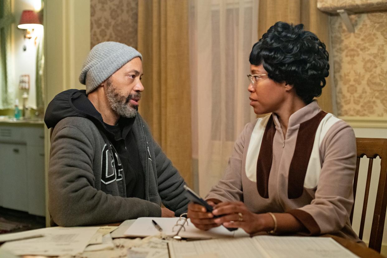 Writer-director John Ridley talks with Regina King, who plays Black Congresswoman and Democratic presidential candidate Shirley Chisholm, on the set of "Shirley." The movie debuts on Netflix March 22. King also produced the movie, a passion project of hers for 15 years.