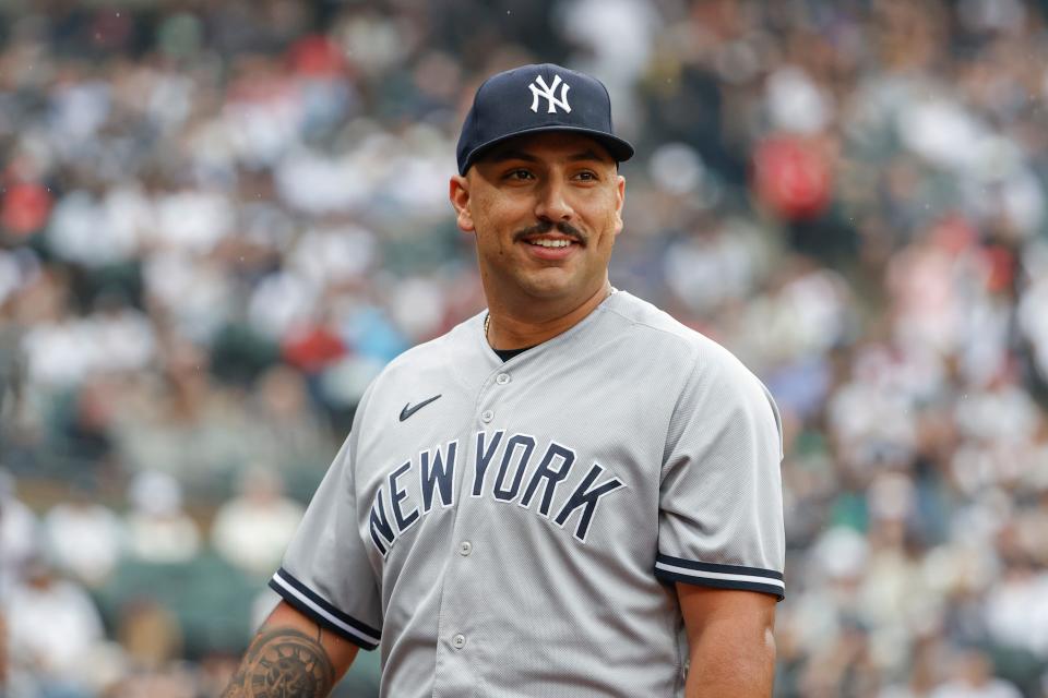 New York Yankees pitcher Nestor Cortes smiles as he returns to dugout after pitching against the Chicago White Sox during the eighth inning of Sunday's game.