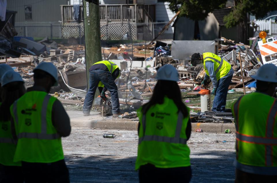 Centerpoint Energy workers drill a hole in the ground on the site of a house explosion at 1010 N. Weinbach Ave., in Evansville, Ind., Thursday morning, Aug. 11, 2022.