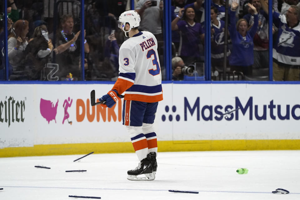 A dejected New York Islanders defenseman Adam Pelech (3) skates off the ice after losing to the Tampa Bay Lightning in Game 7 of an NHL hockey Stanley Cup semifinal playoff series Friday, June 25, 2021, in Tampa, Fla. (AP Photo/Chris O'Meara)