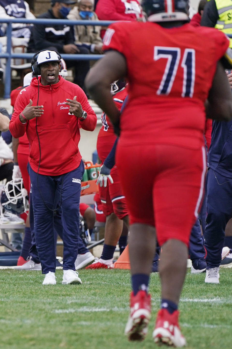 Jackson State head coach Deion Sanders calls out to his offense during the second half of an NCAA college football game against Edward Waters in Jackson, Miss., Sunday, Feb. 21, 2021. The game marked the coaching debut of Sanders. (AP Photo/Rogelio V. Solis)