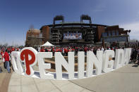 FILE - In ths March 28, 2019, file photo, fans gather for the Philadelphia Phillies opening day baseball game against the Atlanta Braves at Citizens Bank Park in Philadelphia. To baseball fans, opening day is an annual rite of spring that evokes great anticipation and warm memories. This year's season was scheduled to begin Thursday, March 26, 2020, but there will be no games for a while because of the coronavirus outbreak. (AP Photo/Matt Rourke, File)