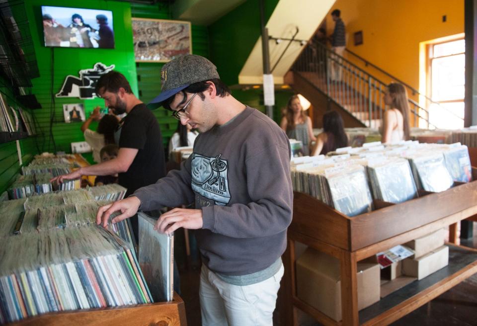 Erik Moline searches through an assortment of vinyl records during Record Store Day 2016 at Hitt Records.