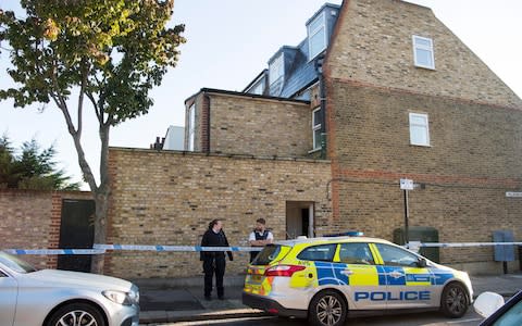 Police outside the property in Southfields, Wimbledon - Credit: Paul Grover for The Telegraph 