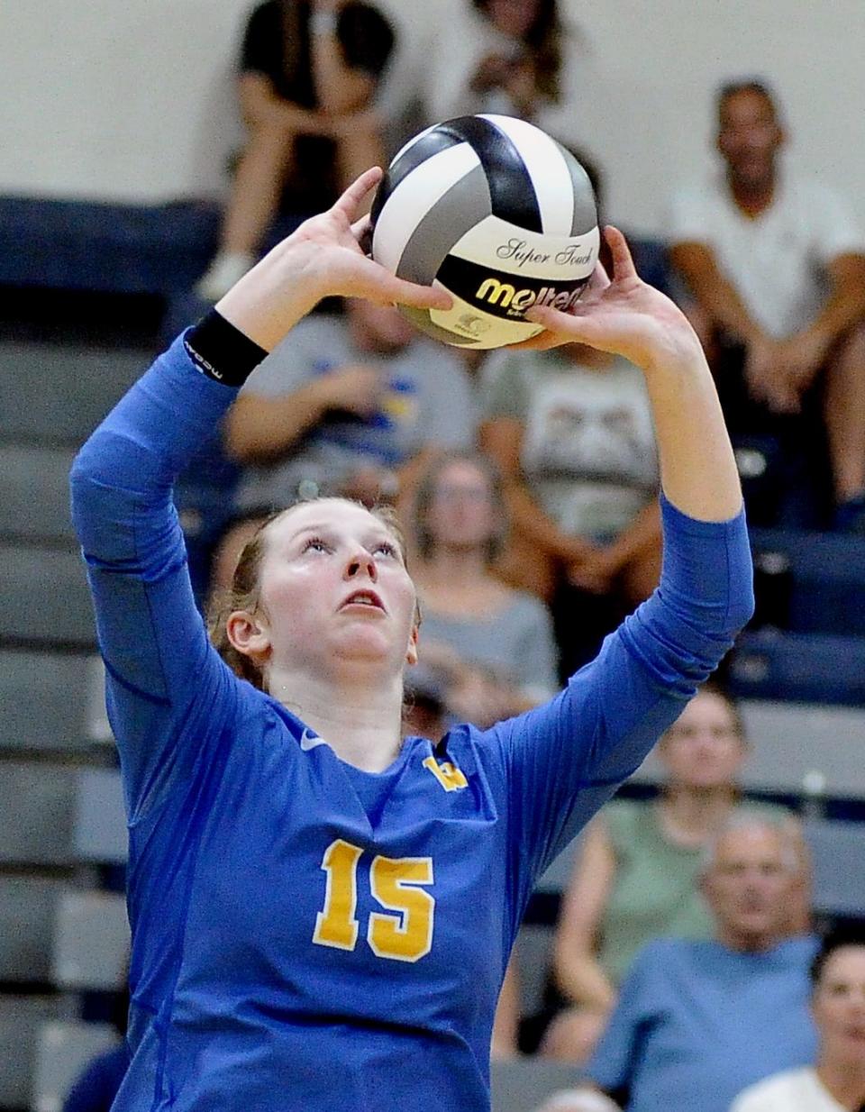 Wooster's Marin Dixon sets for her hitters.