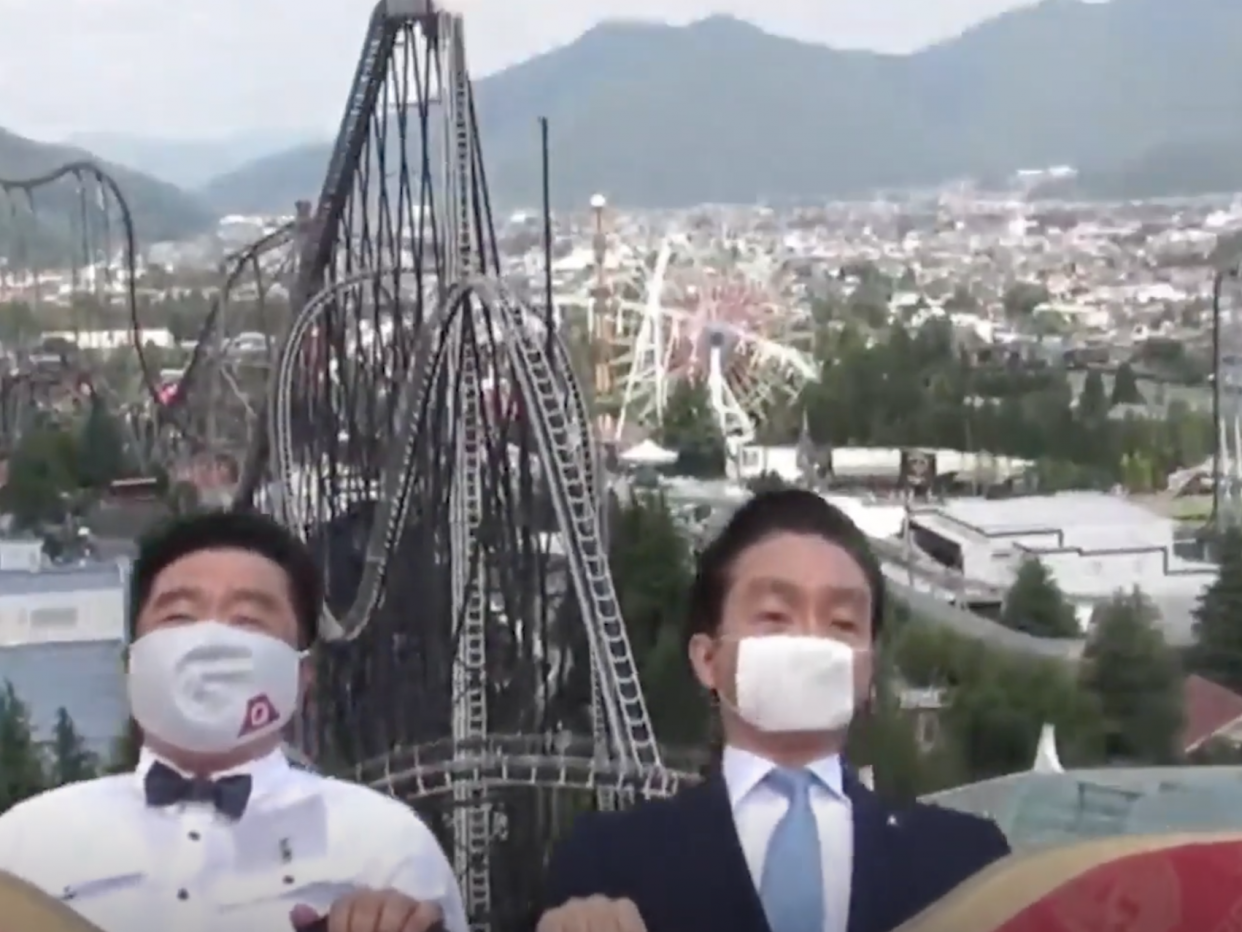 A still imaged taken from a video showing two executives on a rollercoaster ride at Fuji-Q Highland theme park, Japan: Fuji-Q HighlandOfficial