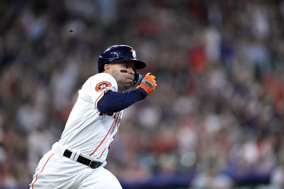 Houston Astros' Jose Altuve runs up the first base line after hitting a double during the first inning of a baseball game against the Oakland Athletics Saturday, May 20, 2023, in Houston. (AP Photo/David J. Phillip)