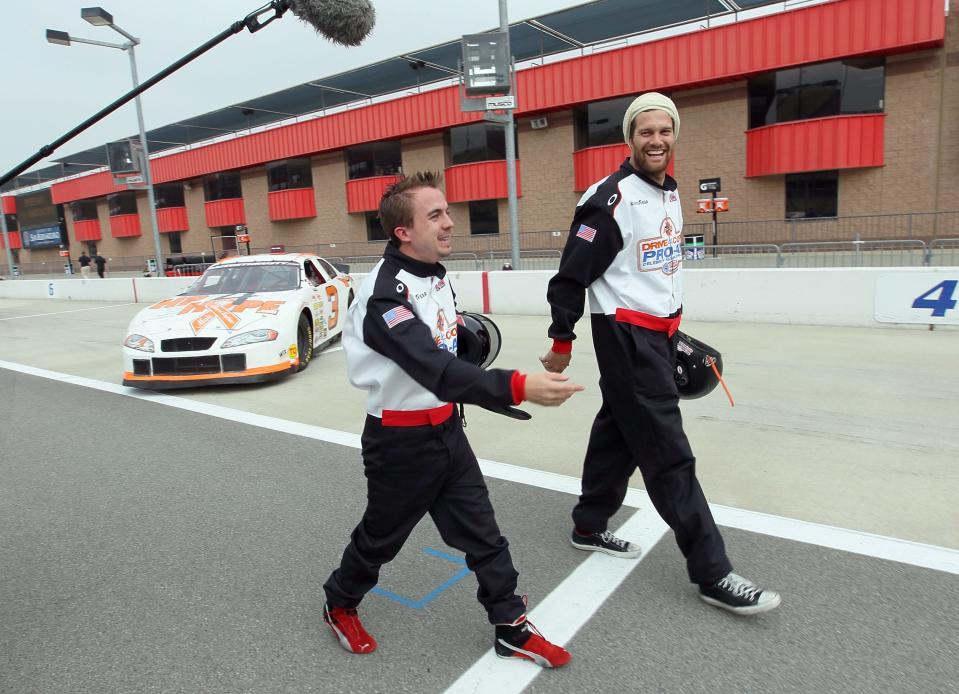 Frankie Muniz (left) in 2012 with fellow driver Geoff Stultz before a celebrity race at Auto Club Speedway in Fontana, Calif.