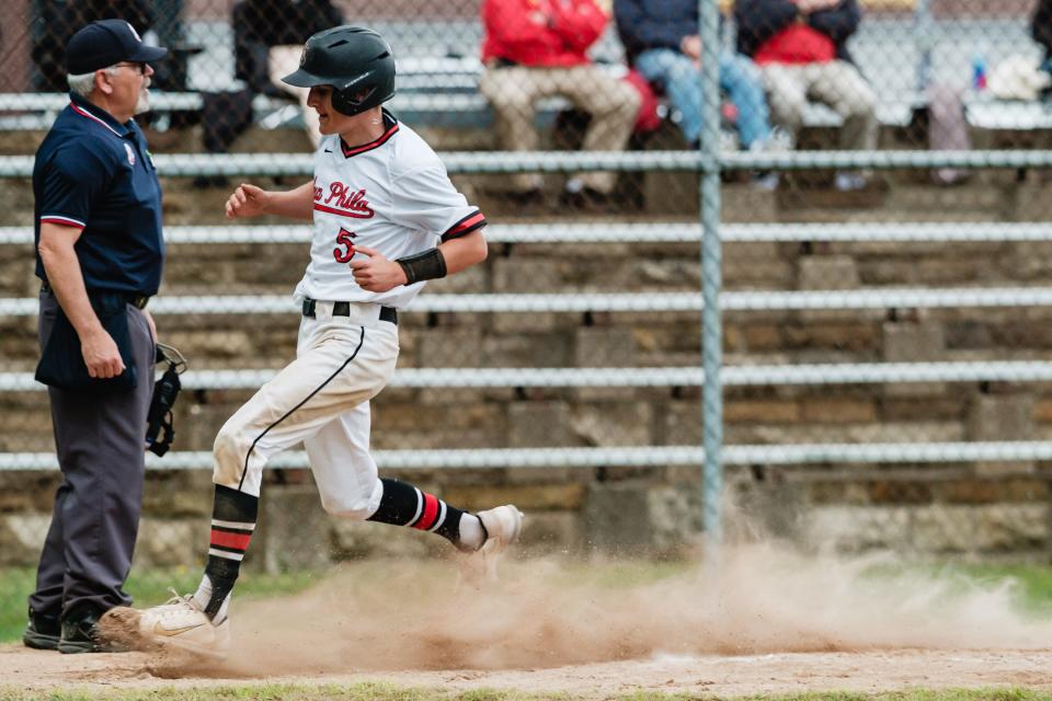 New Phila's Cameron Wright trots into home during a DII East Sectional Championship game against East Liverpool, Tuesday, May 14 at Tuscora Park.