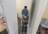 A health care worker takes a nasal swab sample from a Palestinian child at a COVID-19 testing center, in the Palestine Medical Complex, in the West Bank city of Ramallah, Tuesday, March 2, 2021. (AP Photo/Nasser Nasser)