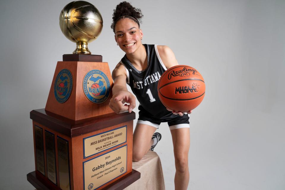 Gabby Reynolds of Holland West Ottawa accepts the 2024 Mick McCabe Miss Basketball Award at the Detroit Free Press on Monday, March 18, 2024.