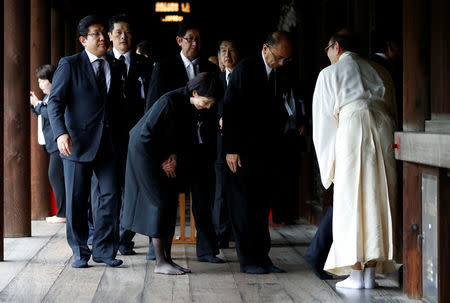 A group of lawmakers including former minister for Internal Affairs and Communications Sanae Takaichi (C) leaves after offering prayers for the war dead at Yasukuni Shrine in Tokyo, Japan, August 15, 2017, to mark the 72nd anniversary of Japan's surrender in World War Two. REUTERS/Issei Kato