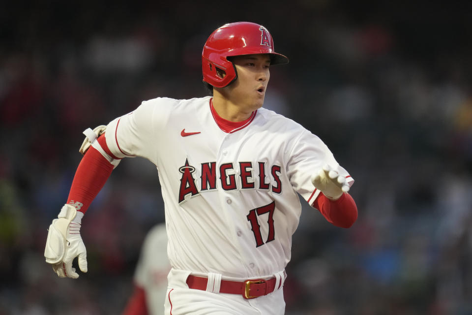 Los Angeles Angels designated hitter Shohei Ohtani (17) runs to first while grounding out during the second inning of a baseball game against the Washington Nationals in Anaheim, Calif., Monday, April 10, 2023. (AP Photo/Ashley Landis)