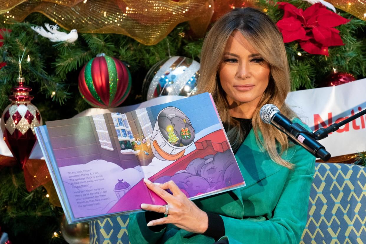 First lady Melania Trump reads a Christmas book titled, 