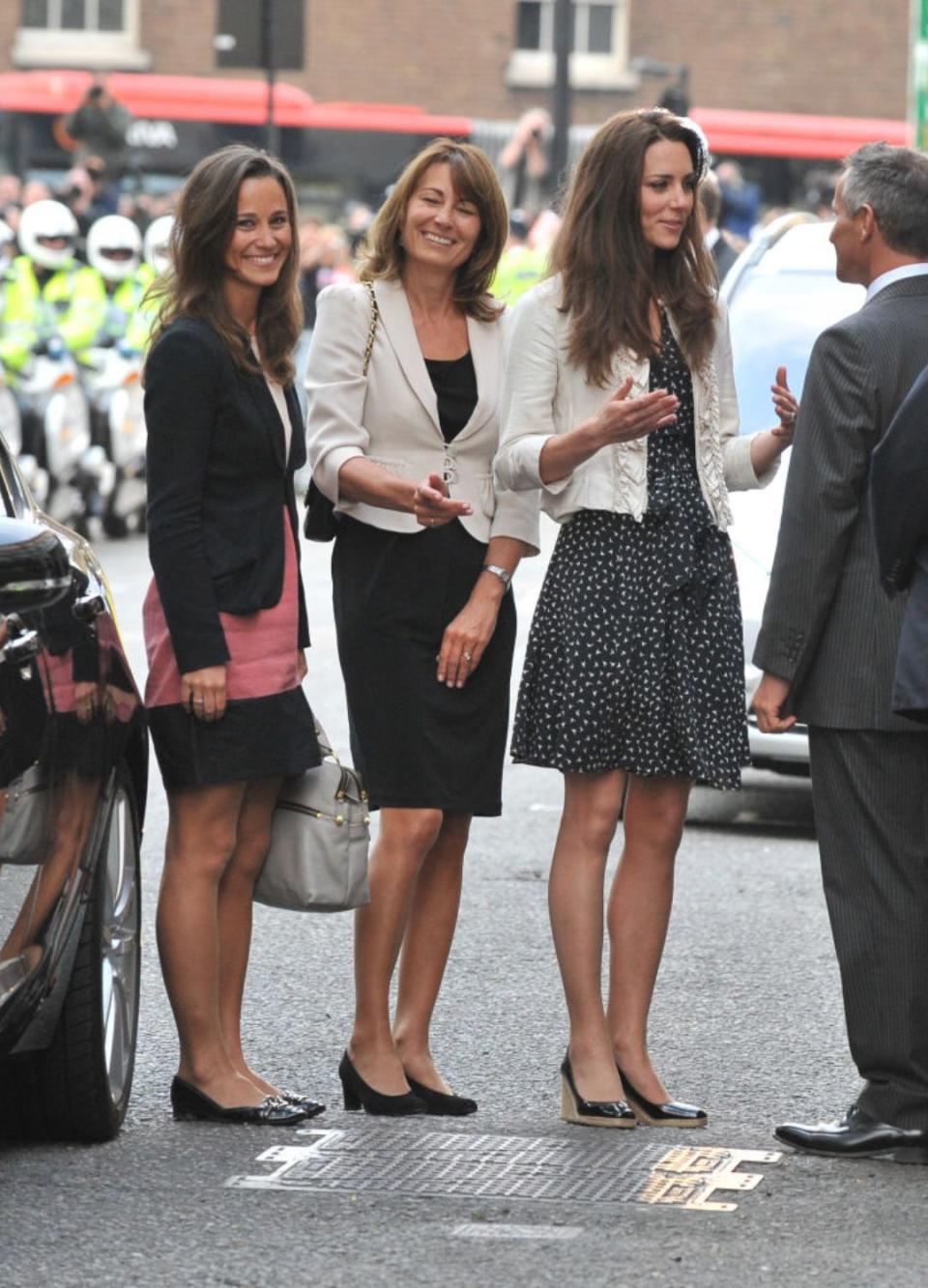 Carole, Catherine and Pippa Middleton outside a hotel, 2011