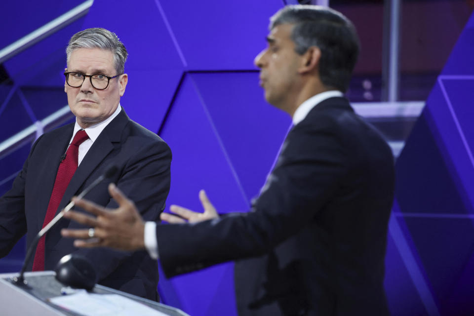 FILE - Britain's Prime Minister Rishi Sunak and opposition Labour Party leader Keir Starmer, left, take part for the BBC's Prime Ministerial Debate, in Nottingham, England, on June 26, 2024. Even in a busy year of elections, the next few days stand out. Voters go to the polls over the next week in fledgling democracies like Mauritania and Mongolia, in the Islamic Republic of Iran and in the stalwart democracies of Britain and France. (Phil Noble/Pool via AP, File)