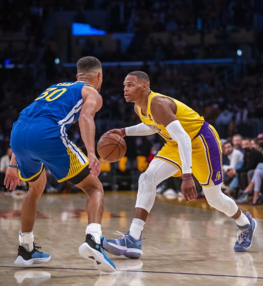 Los Angeles, CA - October 19: New Los Angeles Lakers guard Russell Westbrook drives to the hoop against Golden State.