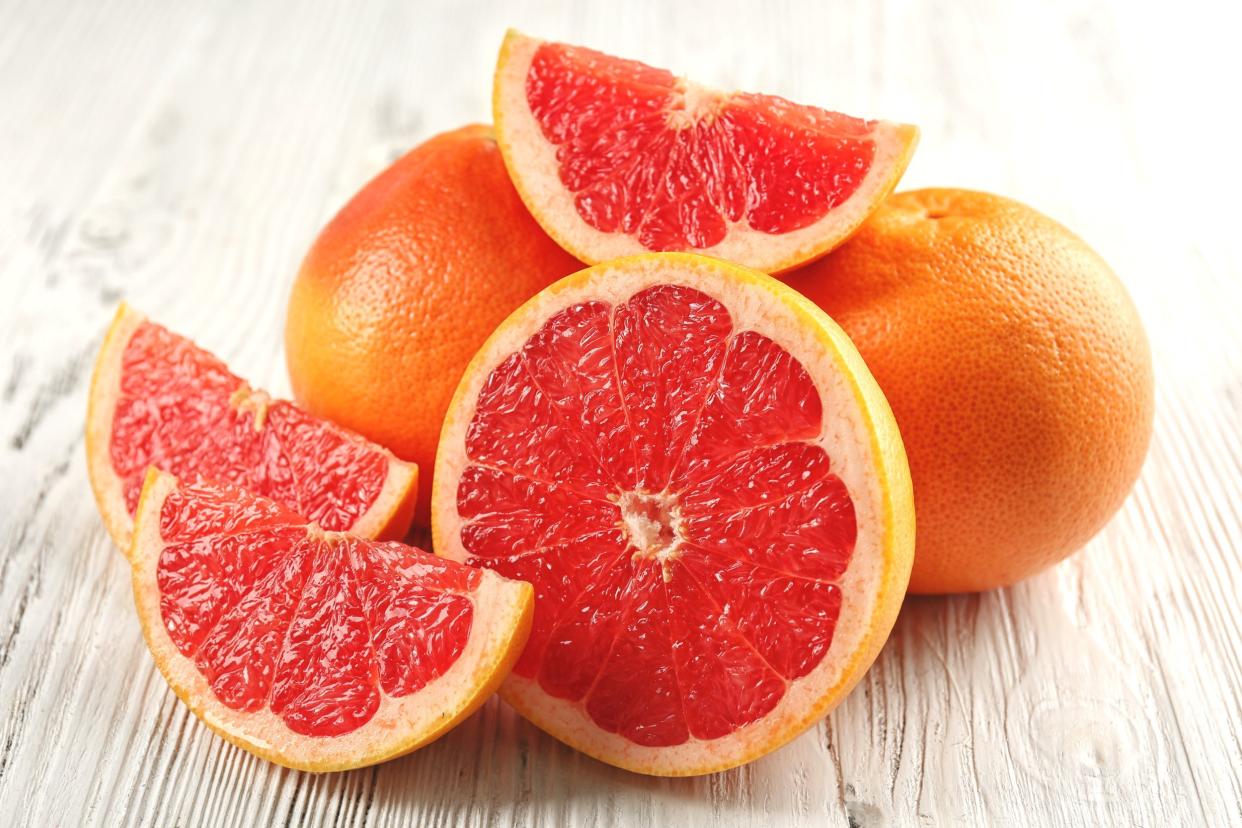 juicy grapefruits on wooden background