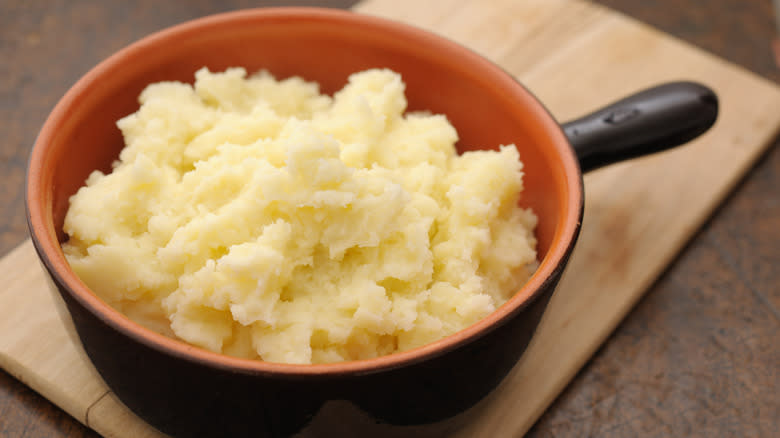 mashed potatoes in handled bowl