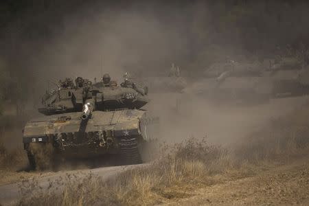 An Israeli convoy manoeuvres outside central Gaza Strip July 19, 2014. REUTERS/Amir Cohen