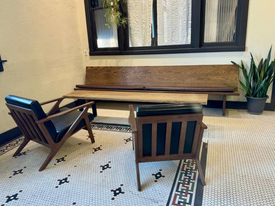 A new conversation area with wooden chairs and a banquette now occupy the back of the cafe space at 930 W. Douglas. Pennant Coffee opened there on Saturday.