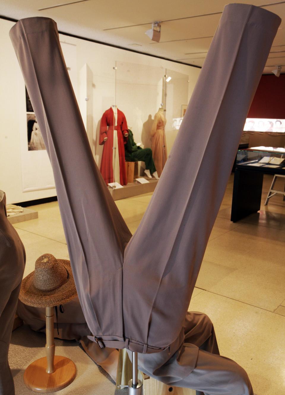 A display of slacks and jodhpurs is shown as part of the "Katharine Hepburn: Dressed for Stage and Screen" exhibit in the New York Public Library for the Performing Arts at Lincoln Center, Tuesday, Oct. 16, 2012. (AP Photo/Richard Drew)