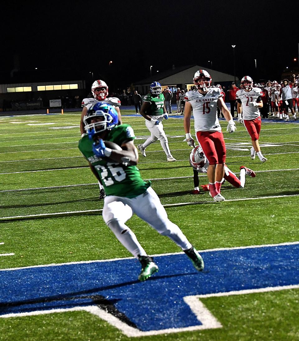 Tyler Gooding (26) scores the game-winning touchdown for Winton Woods as the Warriors top La Salle 12-6 in OHSAA Division II, round one, playoff football at Winton Woods High School, Oct. 27, 2023.