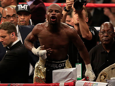 Mayweather celebrates.