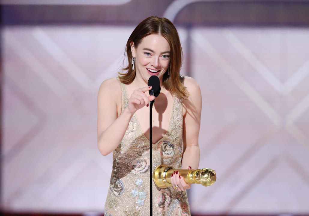 Emma Stone accepts the award for Best Performance by a Female Actor in a Motion Picture, Musical or Comedy at the Golden Globes in Beverly Hills, Calif., on Sunday. (Rich Polk/Golden Globes 2024 via Getty Images)