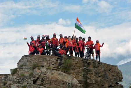 Buddhist nuns from the Drukpa lineage pose for a picture in Himachal Pradesh during their cycle across the Himalayas to raise awareness about human trafficking of girls and women in the impoverished villages in Nepal and India, August 30, 2016. REUTERS/Live To Love International/Handout via REUTERS