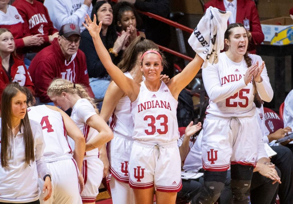 Indiana's Sydney Parrish (33) celebrates a Hoosier three-pointer during the Indiana versus Northwood women's basketball game at Simon Skjodt Assembly Hall on Wednesday, Nov. 1, 2023.