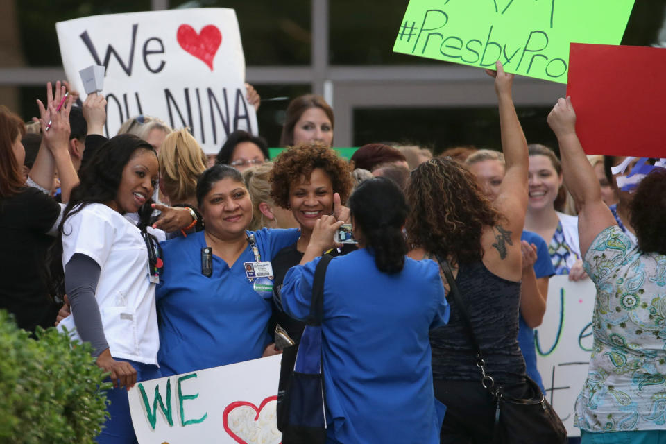 Nurses from Texas Health Presbyterian Hospital rally in support of their employer outside the hospital October 17, 2014 in Dallas, Texas. Two of the hospital's nurses also contracted the virus while treating Thomas Eric Duncan, the Liberian who was the first patient diagnosed with Ebola in the United States.