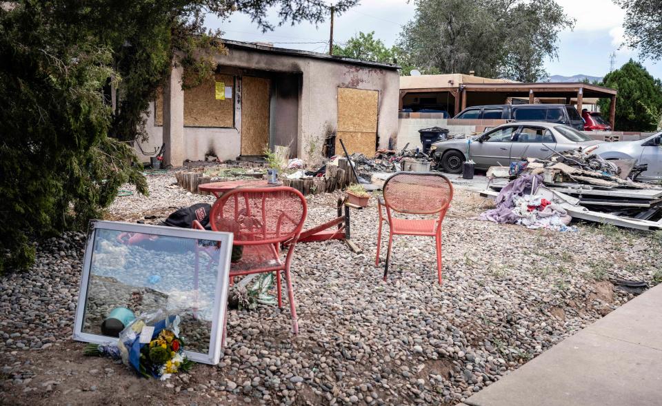 Pictured is a bouquet of flowers left at the site of a scene where a swat standoff took place on Thursday morning, July 7, 2022, in Albuquerque, N.M., in which a teenager died.