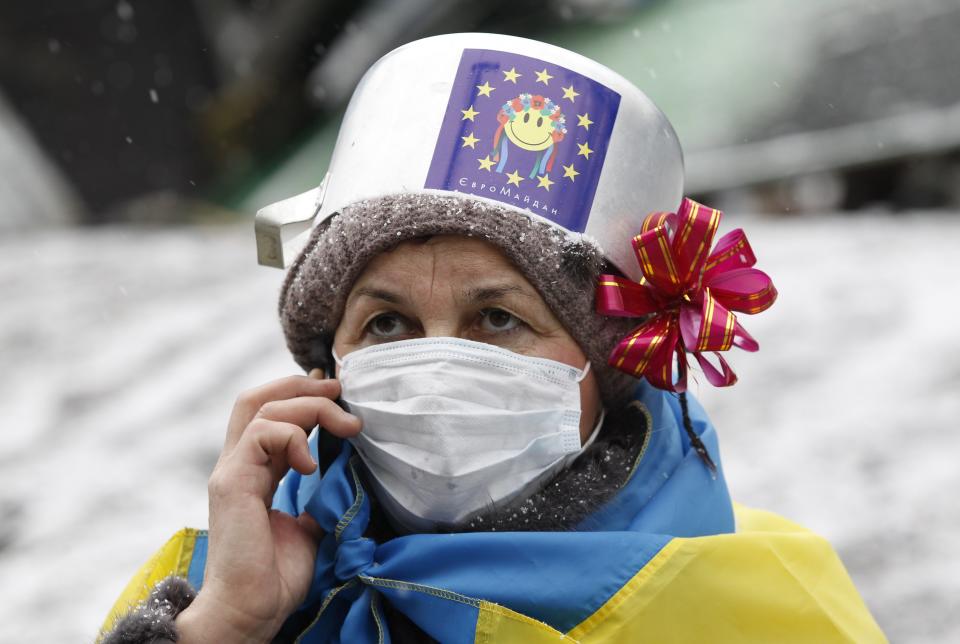 A demonstrator speaks on the phone during a rally held by pro-European integration protesters in Kiev