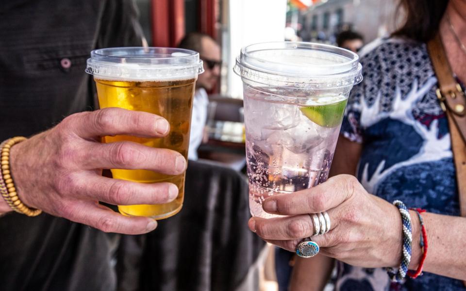 Drinks with plastic lids served outside Heidi bar in Balham - Jeff Gilbert