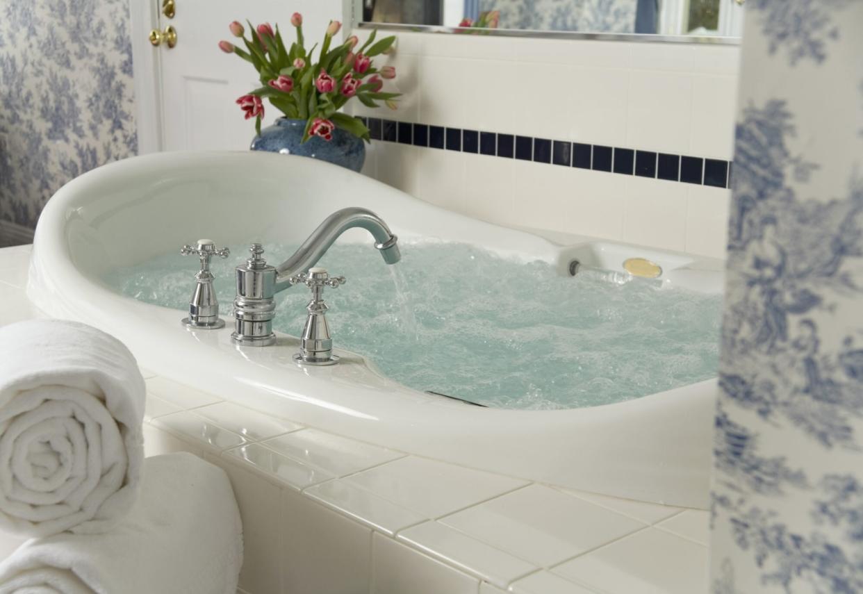 jetted bath tub with flowers