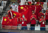 China's team supporters cheer Quan Hongchan of China during women's diving 10m platform final at the Tokyo Aquatics Centre at the 2020 Summer Olympics, Thursday, Aug. 5, 2021, in Tokyo, Japan. (AP Photo/Dmitri Lovetsky)