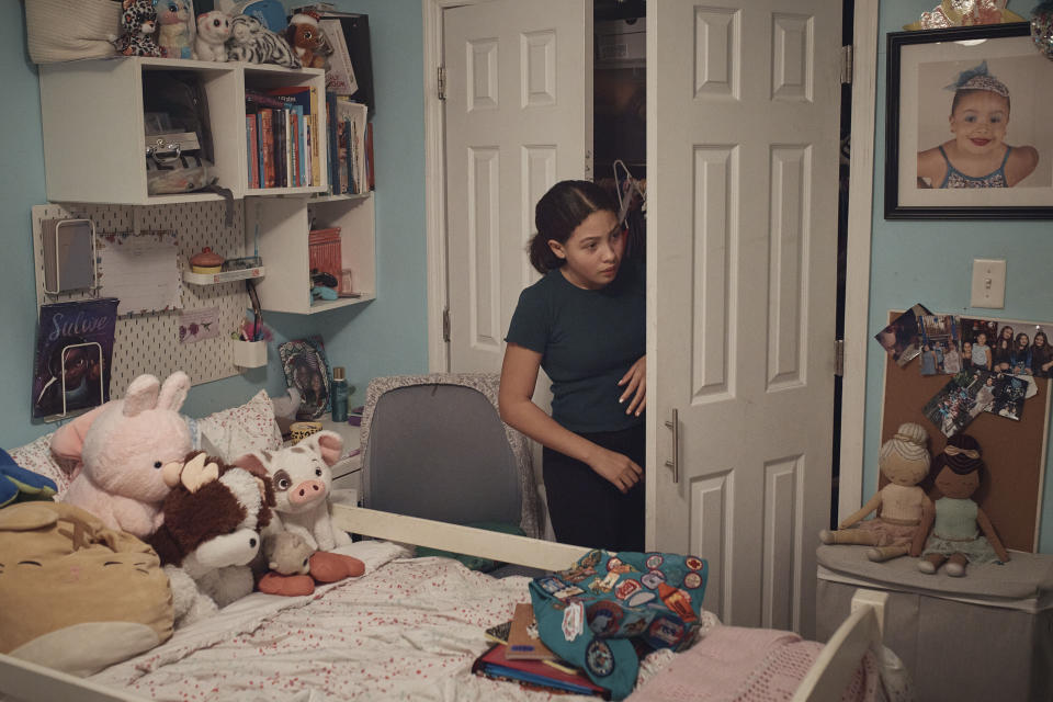 Grace Durham, 11, checks her wardrobe inside her room on Saturday, Jan. 27, 2024, in New York. No longer just a distraction or a way to connect with friends, social media has matured into a physical space and a community that almost all U.S. teenagers belong to. Up to 95% of teenagers say they use social media, with more than one-third saying they are on it “almost constantly,” according to the Pew Research Center. (AP Photo/Andres Kudacki)