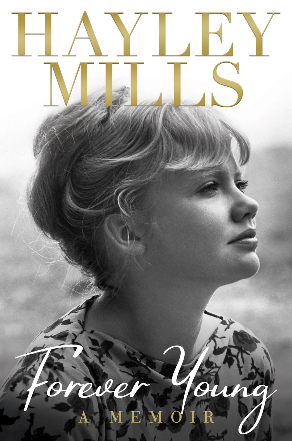 This cover image released by Grand Central Publishing shows "Forever Young," a memoir by Hayley Mills. (Grand Central Publishing via AP)