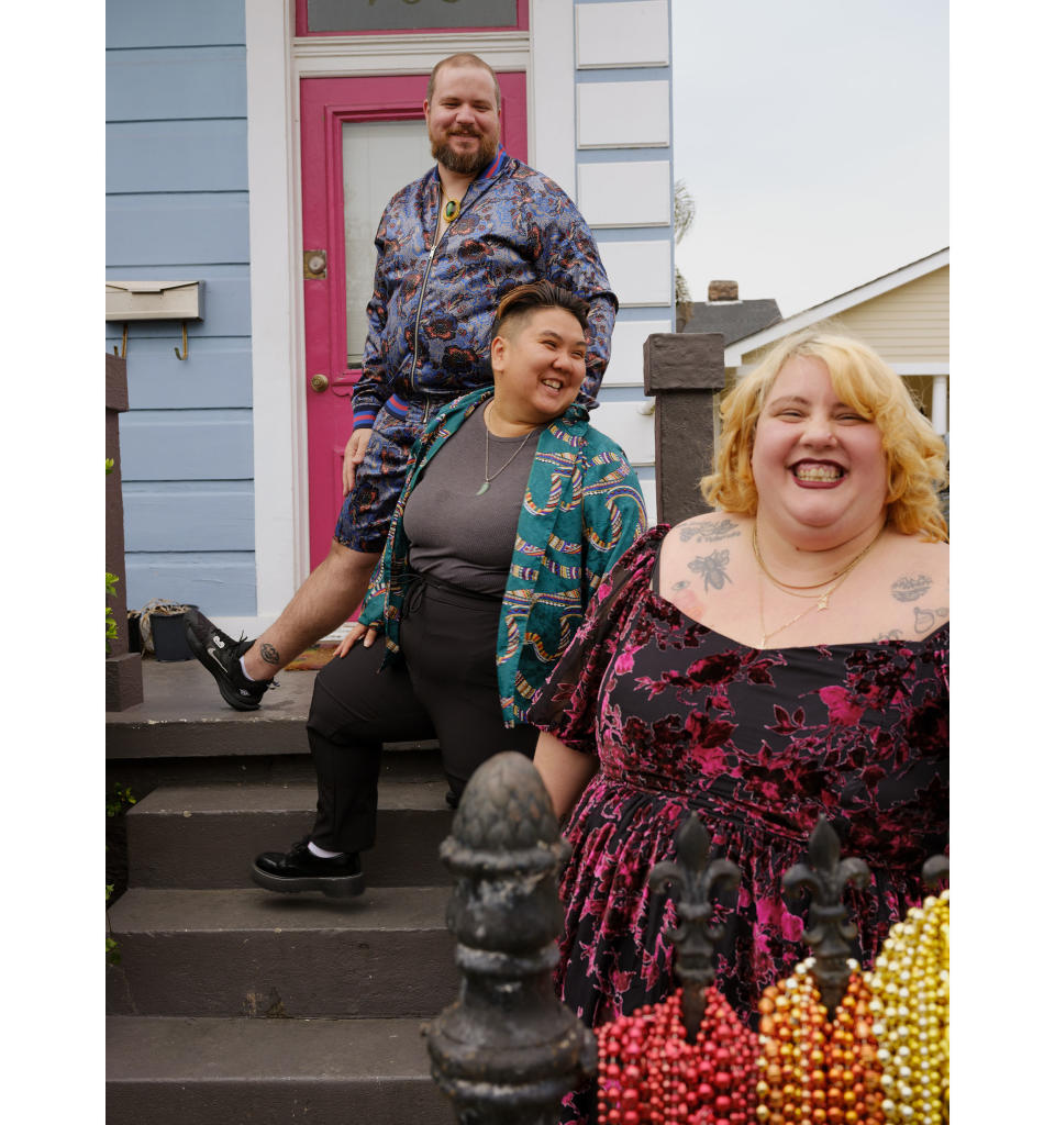Jade, 29; Ami (center), 30; and Daniel, 33, pose for a portrait at their home in New Orleans on March 18, 2023.