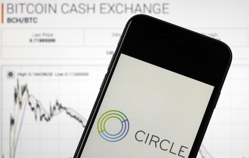 PARIS, FRANCE - FEBRUARY 27:  In this photo illustration, US mobile payment company Circle application is seen on the screen of an iPhone in front of the Poloniex cryptocurrency exchange website on February 27, 2018 in Paris, France. US company Circle, funded by Goldman Sachs, today announced the acquisition of the exchange platform Poloniex, a heavyweight in the sector. According to an anonymous source interviewed by Fortune, Circle, which is now one of the largest players in this market, would have disbursed dollars 400 million for this acquisition. The company is now preparing to launch Circle Invest, a cryptocurrency purchase application for individuals. (Photo Illustration by Chesnot/Getty Images)