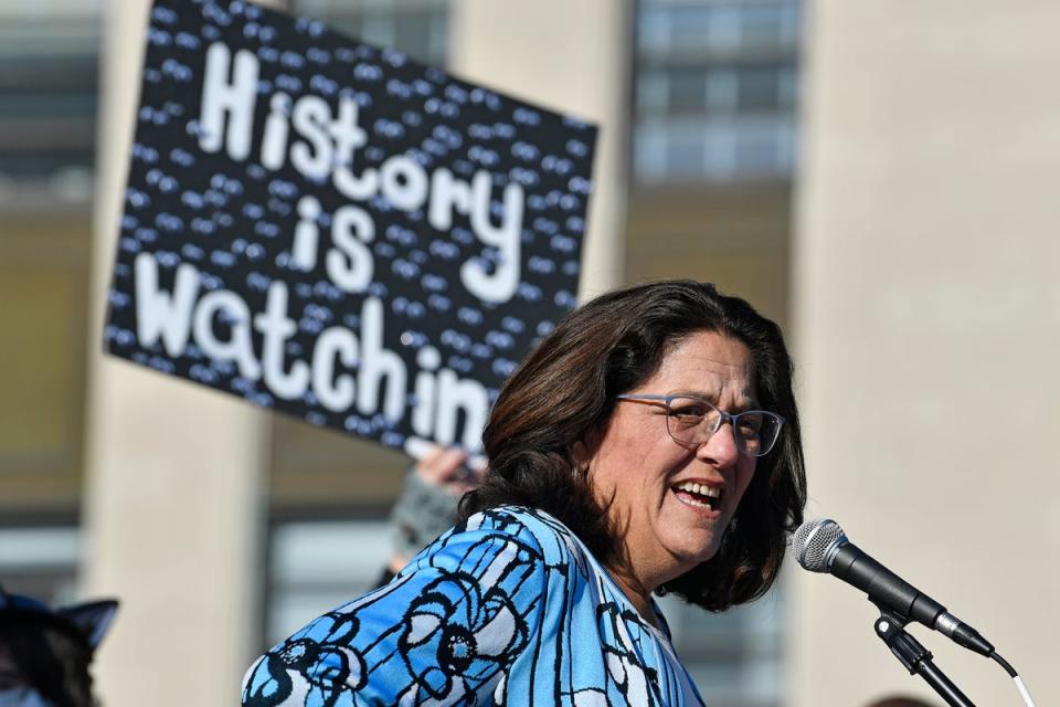 Kentucky state Senator Karen Berg, whose transgender son died by suicide in 2022, addresses a crowd protesting a sweeping bill targeting LGBT+ people on 29 March. (AP)