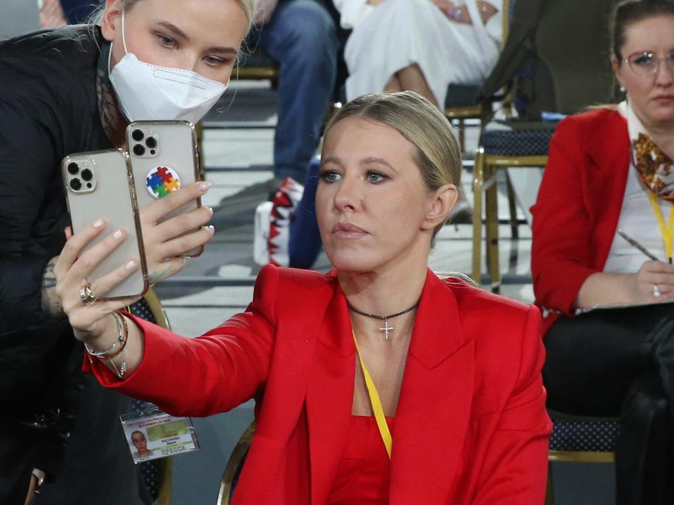 Russian journalist and former candidate for Presidential Elections Ksenia Sobchak takes a selfie photo during Vladimir Putin's annual press conference