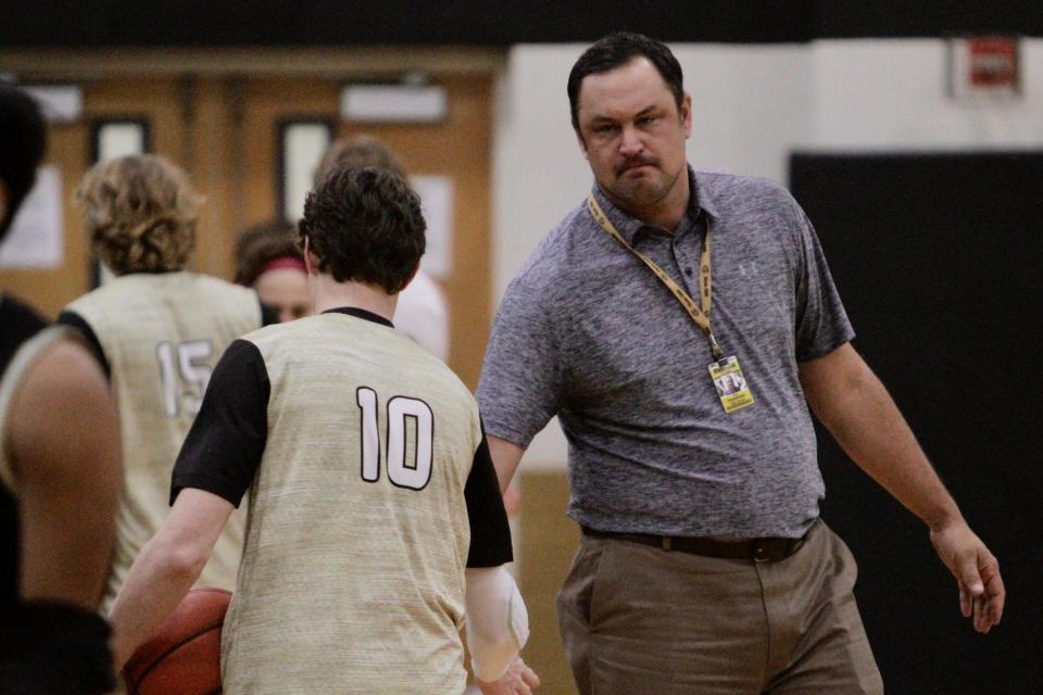 Clyde interim coach Don Heseman shakes hands with sophomore Blake Carr before the Bulldogs' game against Brady on Tuesday.