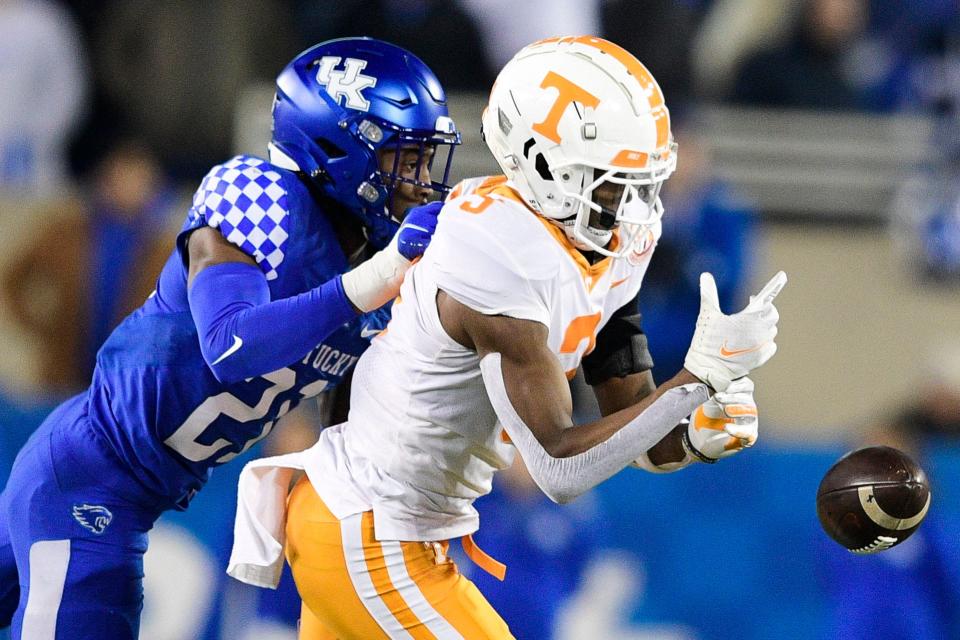 Tennessee wide receiver JaVonta Payton (3) fumbles a pass as Kentucky defensive back Tyrell Ajian (23) defends during an SEC football game between Tennessee and Kentucky at Kroger Field in Lexington, Ky. on Saturday, Nov. 6, 2021.