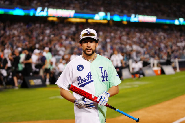 Rapper and singer Bad Bunny runs in the outfield during the MLB All Star  Celebrity Softball game, Saturday, July 16, 2022, in Los Angeles. (AP  Photo/Mark J. Terrill)